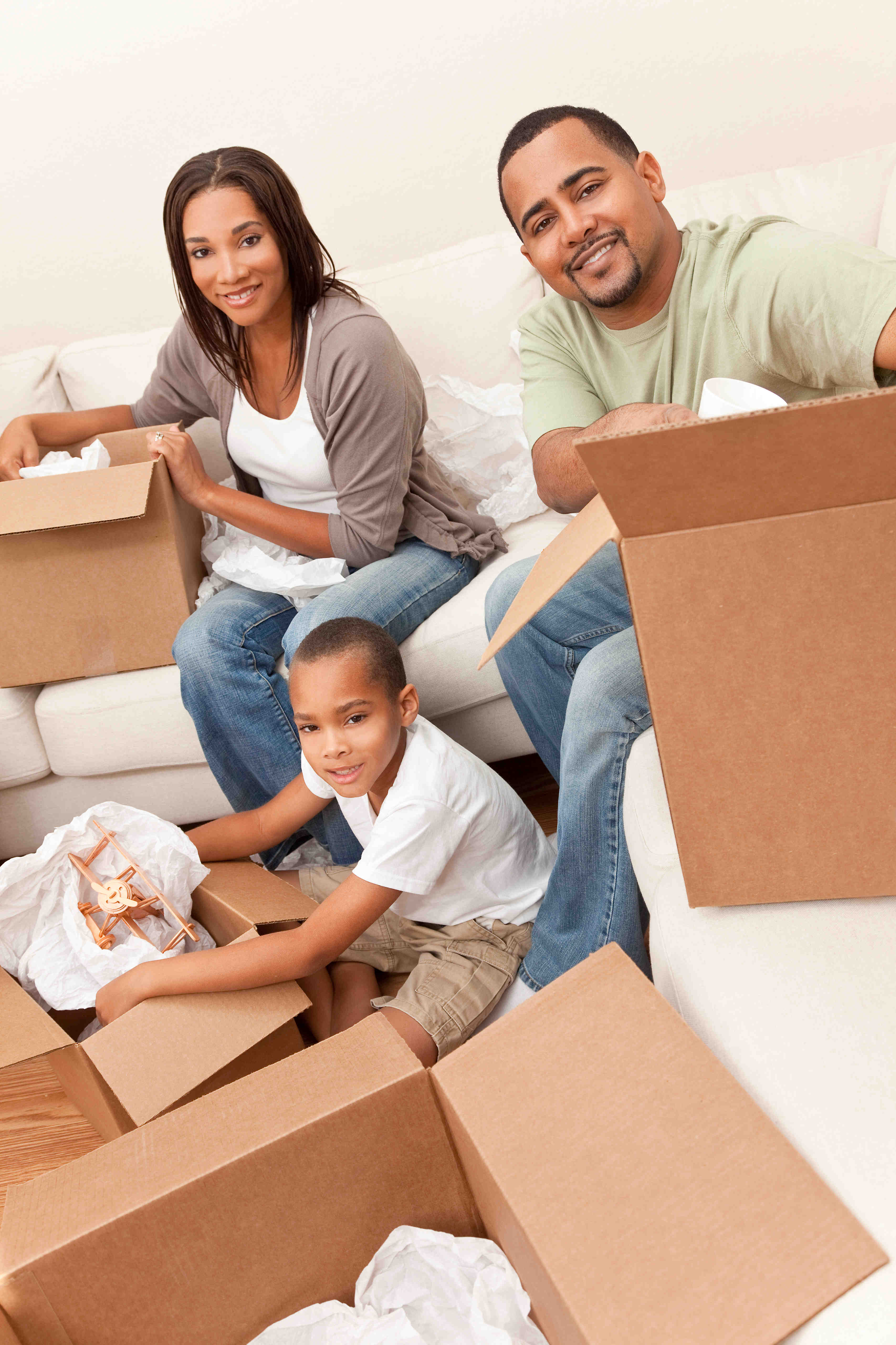 African American family unpacking in their new home after being moved by Advance Movers in Greenville NC.